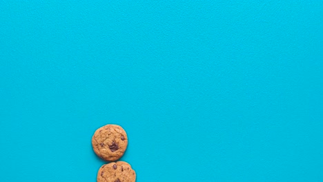 Chocolate-chips-cookies-and-milk,-top-view-stop-motion